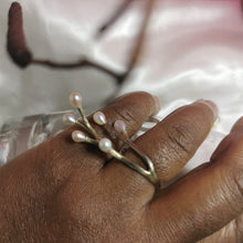 Load image into Gallery viewer, Black woman wearing vermeil yellow gold ring with twig design placed on satin white fabric
