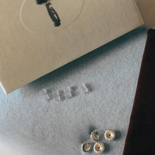 Load image into Gallery viewer, Silver and silicone earrings posts on  white velvet