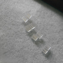 Load image into Gallery viewer, Silicone earrings stoppers on white velvert