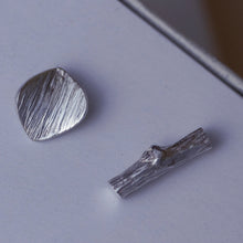 Load image into Gallery viewer, Mismatched stud earrings, silver twig and tiny leaf