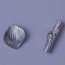 Load image into Gallery viewer, Mismatched stud earrings, silver twig and tiny leaf