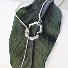 Load image into Gallery viewer, Lariat necklace, silver flower clasp in front