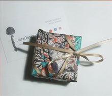 Charger l'image dans la galerie, Send some love with the gift wraps options I offer, small box wrapped in a blue and orange paper with a cream color ribbon