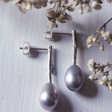 Load image into Gallery viewer, Pearl_drop_earrings-oval_grey_pearls on white background with dried white flowers