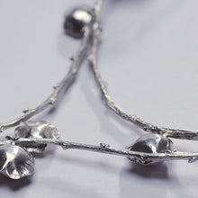 Load image into Gallery viewer, Large silver necklace, pearl flowers and twig statement necklace, face down on white background