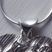Load image into Gallery viewer, Large textured heart pendant with a cut-out little heart