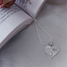 Load image into Gallery viewer, Large textured heart pendant with a cut-out little heart