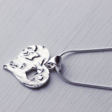 Load image into Gallery viewer, Large textured heart pendant with a cut-out little heart