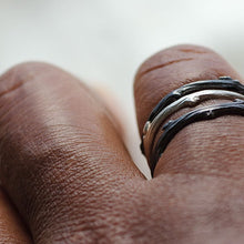 Load image into Gallery viewer, Stack rings, twig, silver or black rhodium- stack of three rings worn - hand on white background