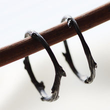 Load image into Gallery viewer, Stack rings, twig, black rhodium on branch - white background