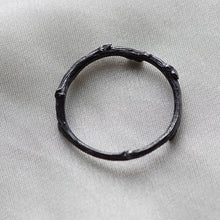 Load image into Gallery viewer, Stack rings, twig, black rhodium on white fabric