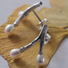 Load image into Gallery viewer, Freshwater pearl earrings, wishbone design twig earrings, placed on dried ginko leaves, close-up shot on profile