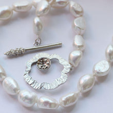 Load image into Gallery viewer, Knotted pearl pendant necklace, silver flower clasp - rolled on white background