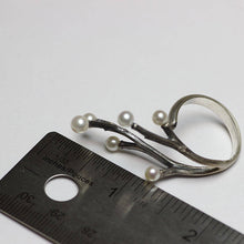 Load image into Gallery viewer, Adjustable ring, silver cocktail ring, twig design covering fingers, branches placed near a ruler - white background