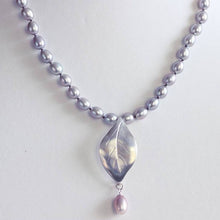 Load image into Gallery viewer, Grey pearls knot necklace, leaf silver pendant necklace placed on a jewelry  bust display