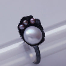 Load image into Gallery viewer, Cocktail ring, black silver, flower and twig designs sets on transparent tube, three quarter view