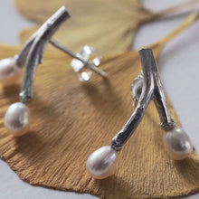 Load image into Gallery viewer, Freshwater pearl earrings, wishbone design twig earrings, placed on dried ginko leaves, close-up shot on the left