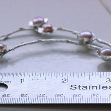 Load image into Gallery viewer, Statement necklace, pearl flowers and twigs necklace, central piece placed near a ruler