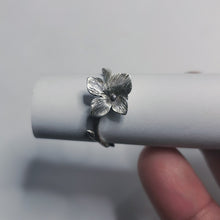 Load image into Gallery viewer, top of adjustable flower ring, ring placed on white tube, white background
