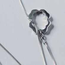 Load image into Gallery viewer, Lariat necklace, silver flower clasp in front
