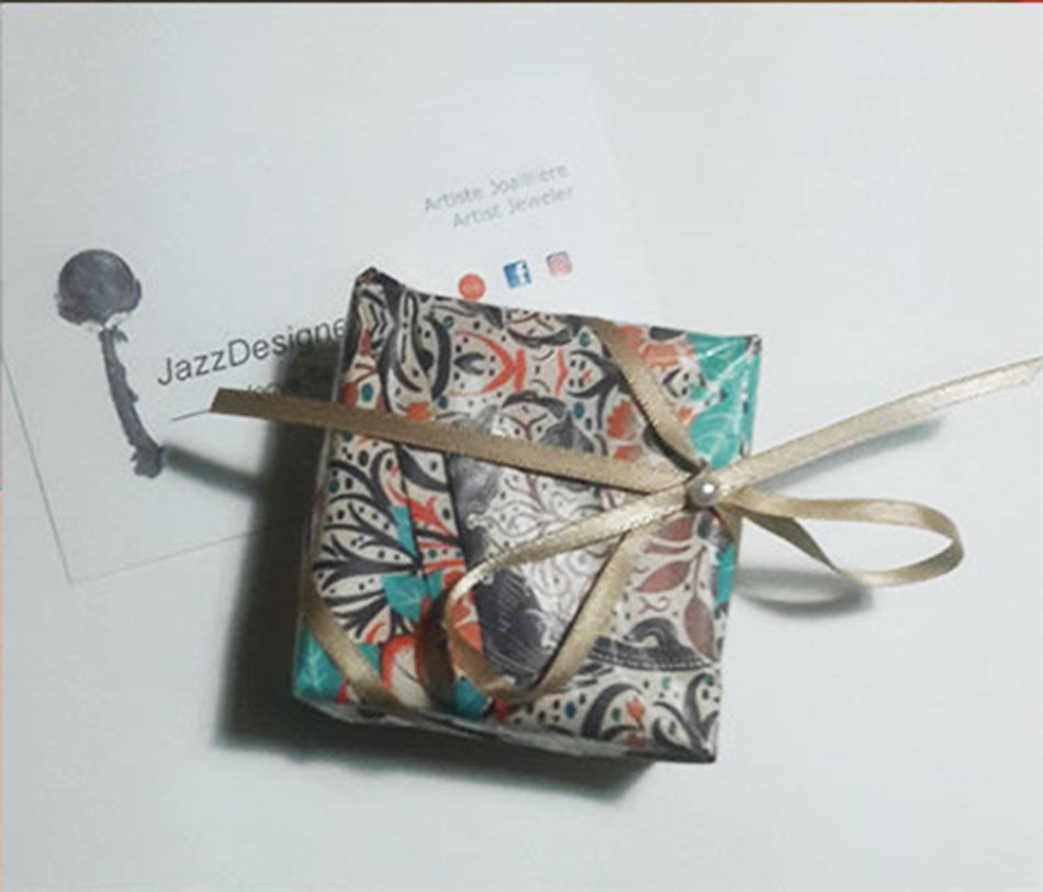 Send some love with the gift wraps options I offer, small box wrapped in a blue and orange paper with a cream color ribbon