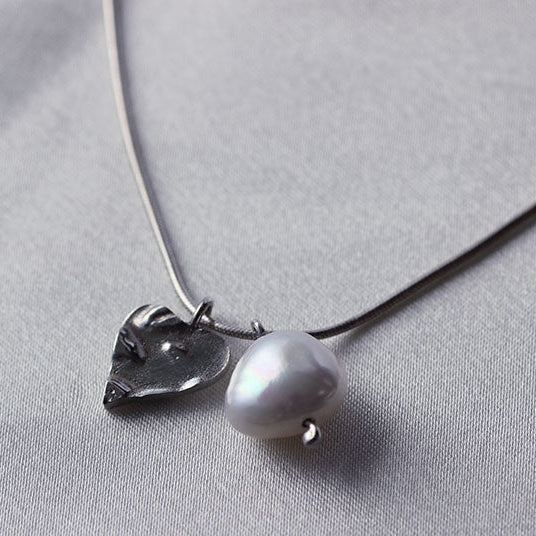 Silver heart necklace and pearl charm