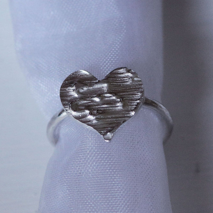 Silver heart shape ring, engraved heart ring for anniversary, slid on an organza pouch, white background