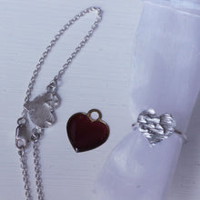 Load image into Gallery viewer, Combo Silver heart shape ring slid on organza pouch, and engraved heart bracelet, read heart in the middle, white background
