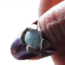 Load image into Gallery viewer, Orchid ring aquamarine worn on thumb Face view
