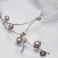 Load image into Gallery viewer, Large silver necklace, pearl flowers and twig statement necklace, face up on a white background
