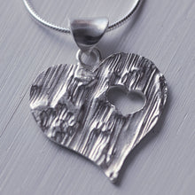 Load image into Gallery viewer, Large textured heart pendant with a cut-out little heart

