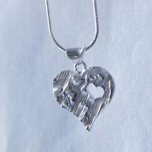 Load image into Gallery viewer, Large textured heart pendant with a cut-out little heart
