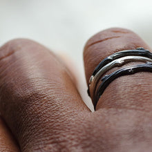 Load image into Gallery viewer, Stack rings, twig, silver or black rhodium- stack of three rings worn - hand on white background
