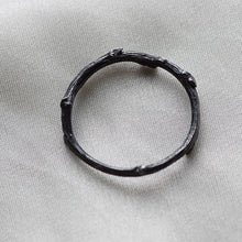 Load image into Gallery viewer, Stack rings, twig, black rhodium on white fabric
