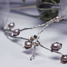 Load image into Gallery viewer, Large silver necklace, pearl flowers and twig statement necklace, white background and chardon flower in the back
