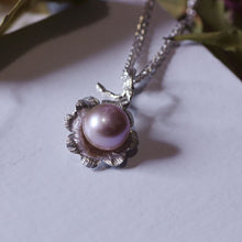 Load image into Gallery viewer, Silver flower pendant, pink pearl, white background, dried leave in the back

