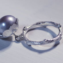 Load image into Gallery viewer, Grey pearl charm ring, profile, placed on a white background
