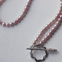 Load image into Gallery viewer, Flower necklace, flower clasp closed on white background
