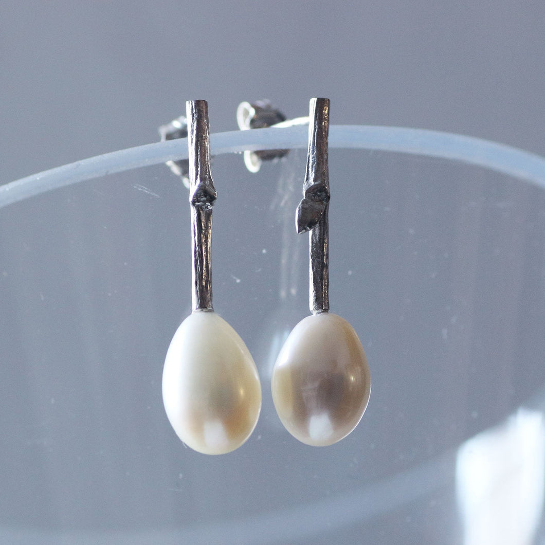 Pearl drop earrings, silver twig.