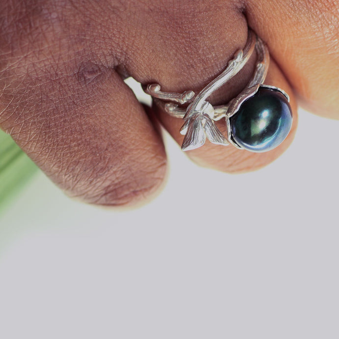 Flower adjustable ring for women weared stack style with a black pearl ring