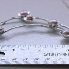 Load image into Gallery viewer, Statement necklace, pearl flowers and twigs necklace, central piece placed near a ruler
