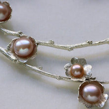 Load image into Gallery viewer, Statement necklace, pearl flowers and twigs necklace, full close-up on the pearl flowers, pink pearls, white background
